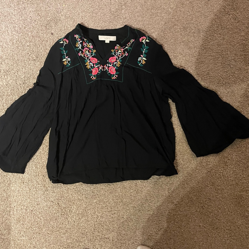 Black blouse with colorful embroidered details